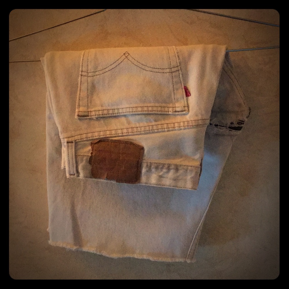 Levi’s destroyed/refurbished white denim cut off X